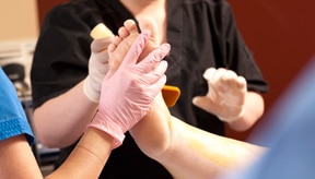 nurse massaging patients feet during varicose vein removal procedure in Plano TX